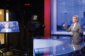 Williams at the anchor desk in NJTV's new custom-built studio and headquarters in downtown Newark.