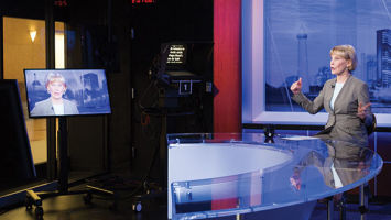 Williams at the anchor desk in NJTV's new custom-built studio and headquarters in downtown Newark.
