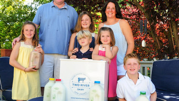 Jeanine and Chris Doody of Two River Dairy, with their children. Photo: Art Petrosemolo