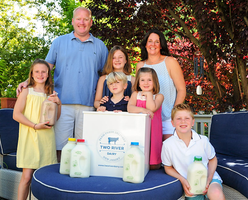 Jeanine and Chris Doody of Two River Dairy, with their children. Photo: Art Petrosemolo