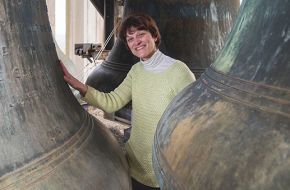 Lisa Lonie stands near the largest bells in Grover Cleveland Tower. When played each Sunday at 1 p.m., the music can be heard up to a mile away.