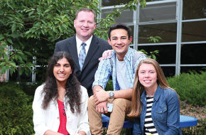 Principal Darren Groh celebrates Chatham High School's repeat atop the New Jersey Monthly chart with, from left, seniors Nishita Sinha, Eric Davis and Kate Purschke.