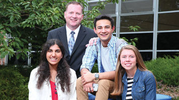 Principal Darren Groh celebrates Chatham High School's repeat atop the New Jersey Monthly chart with, from left, seniors Nishita Sinha, Eric Davis and Kate Purschke.