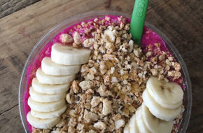 The 8th Ave bowl has sliced bananas, honey and more granola.