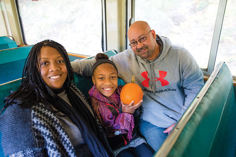 Along the journey, passengers like Nataly and Anthony Taylor of Maryland, left, listen to a public address system, keyed by GPS, that describes sights and local history as the train passes. 
