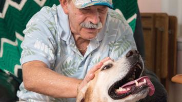 82-year-old John A. Gregory, left, loves his time with his therapy dog Earl.