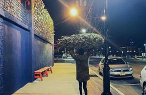 A Christmas tree buyer at Porta in Asbury Park. Photo: Courtesy, Smith