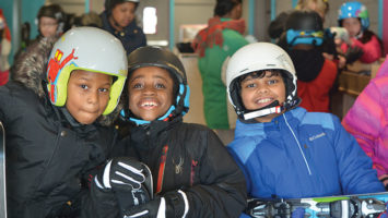 Spirits soar for a trio of last winter's campers at the National Winter Activity Center at the old Hidden Valley Ski Resort in Vernon.