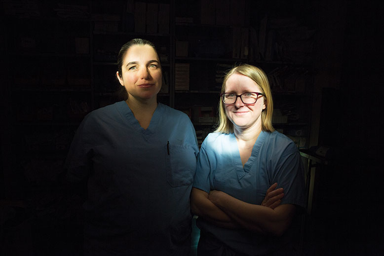 Trauma surgeons Anastasia Kunac, left, and Stephanie Bonne. For both women, starting their own families changed the way they approached the job. Photo by Fred R. Conrad