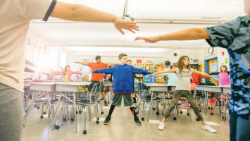 A fifth-grade class at Woodland Elementary School in Monroe Township takes time out for a midday yoga session.