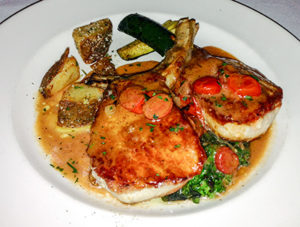 Double-cut pork chop at Scala del Nonna Italian restaurant in Montclair, New Jersey.