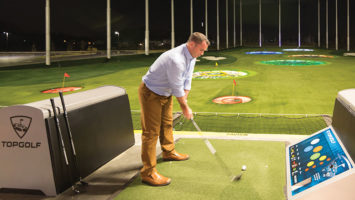 Players at Topgolf in Edison take aim at driving-range targets using microchipped golf balls that track the distance and accuracy of each shot.