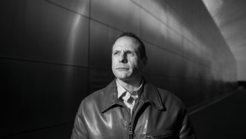 After his release from prison, John Koufos (seen here in Liberty State Park at the Empty Sky memorial to New Jersey’s 9/11 victims) often wandered around Jersey City pondering his future. He found meaningful work at the nonprofit New Jersey Reentry Corporation helping other ex-prisoners.