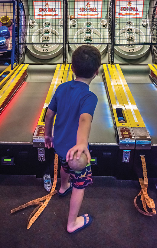 Ahmad Bazbaz, 7, of Pompton Lakes takes his best shot at skeeball.