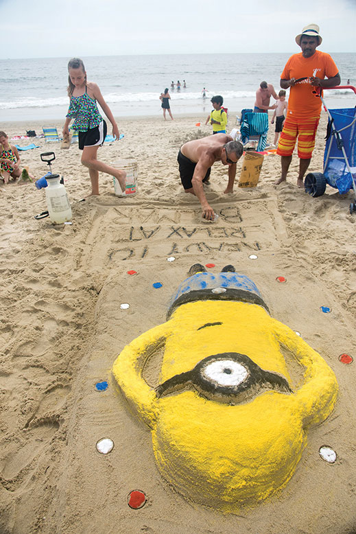 Ted Sabo and daughter Kayla, of Spotswood, put the finishing touches on their Minions creation.