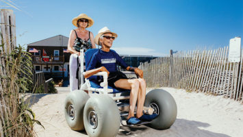 Ed Titterton enjoys summer days on the sand in North Wildwood, thanks to a town-supplied surf chair and the help of his wife, Sue.