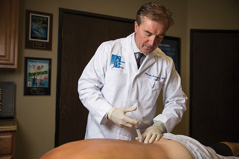 Dr. Marcello Sammarone, a pain-management specialist in Parsippany, administers a trigger-point injection to a patient with myofascial pain. The injections are quick, in-office procedures that require no sedation and soothe muscle spasms.