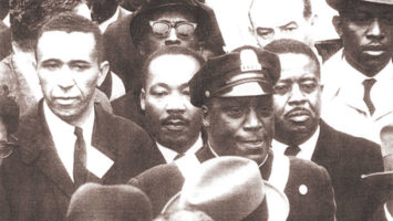 The Reverend Gilbert H. Caldwell joined Dr. Martin Luther King Jr. at a rally in Boston, April 1965.