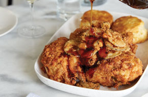 Drizzling chili-steeped honey over fried smoked chicken and biscuits.