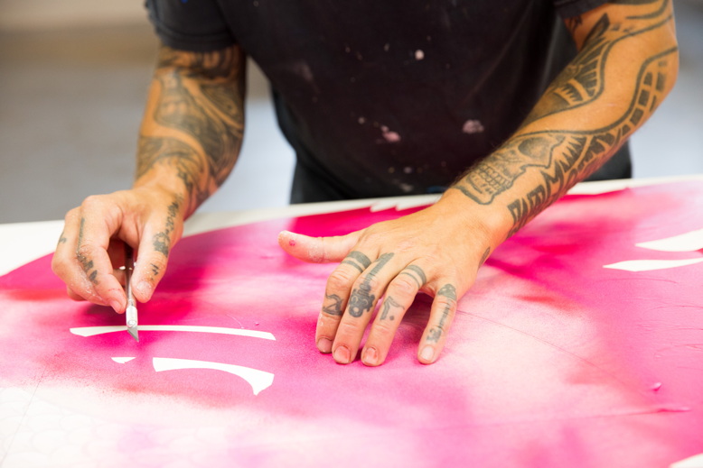 Porkchop works on a panel for Bamboo Leaf Thai Eatery.