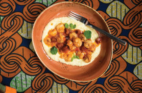 Shrimp with guanciale in Hennessy cognac tomato sauce on polenta and grits.