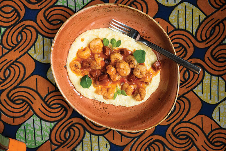 Shrimp with guanciale in Hennessy cognac tomato sauce on polenta and grits.