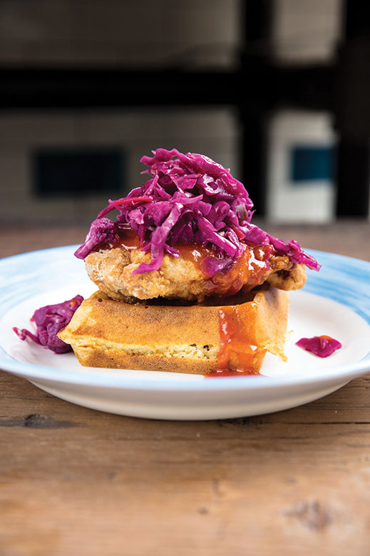 Fried chicken on plantain waffle with pikliz slaw.