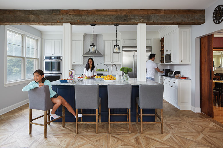 The Ngs’ renovated Jersey City kitchen functions perfectly for the entire family all at once. All major appliances line the back wall. The reclaimed-wood beam is structural, supporting the third floor, but looks decorative.