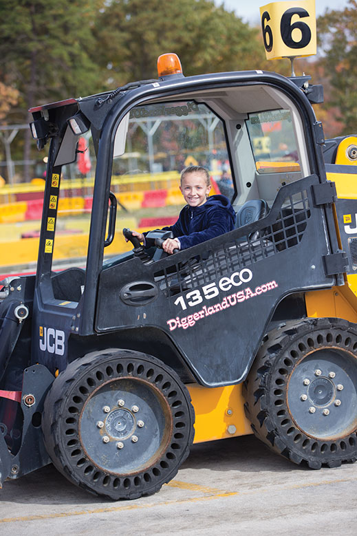 Izzy Ignosh, of Emmaus, Pennsylvania, drives a skid-steer loader.