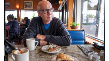 Dan Barry, at Manny’s Texas Weiners in Union, says everything about his decade writing the This Land column was “invigorating” except the travel.