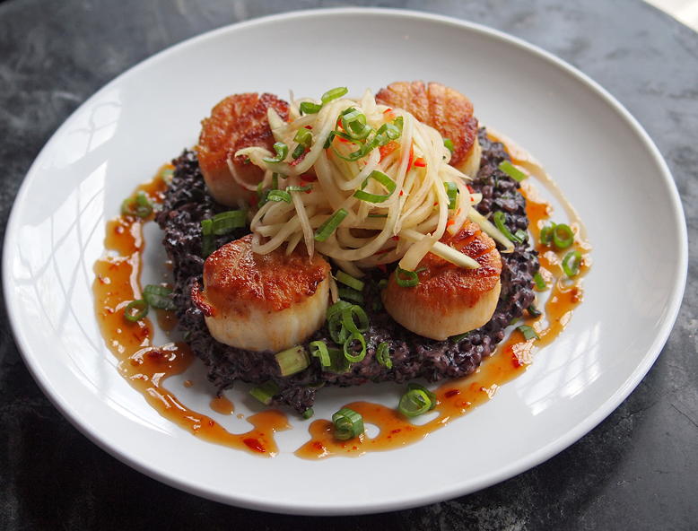 Pan-seared scallops with Thai coconut black rice at Sterling Tavern