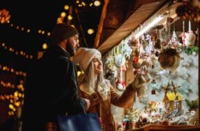 Young couple browsing at holiday market