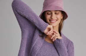 Model wearing a purple loungewear set from Anthropologie.