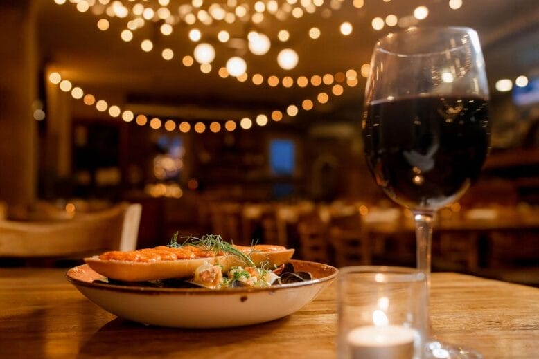 A dish, wine and votive at Cross & Orange in Asbury Park, New Jersey