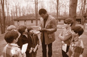 Muhammad Ali signs autographs outside his Cherry Hill home.