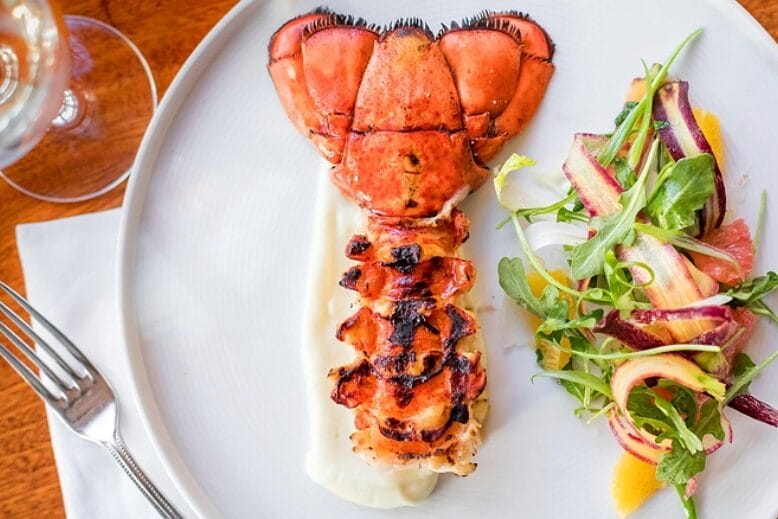 A slightly charred lobster tail with a bright side salad at the Ebbit Room in Cape May, NJ