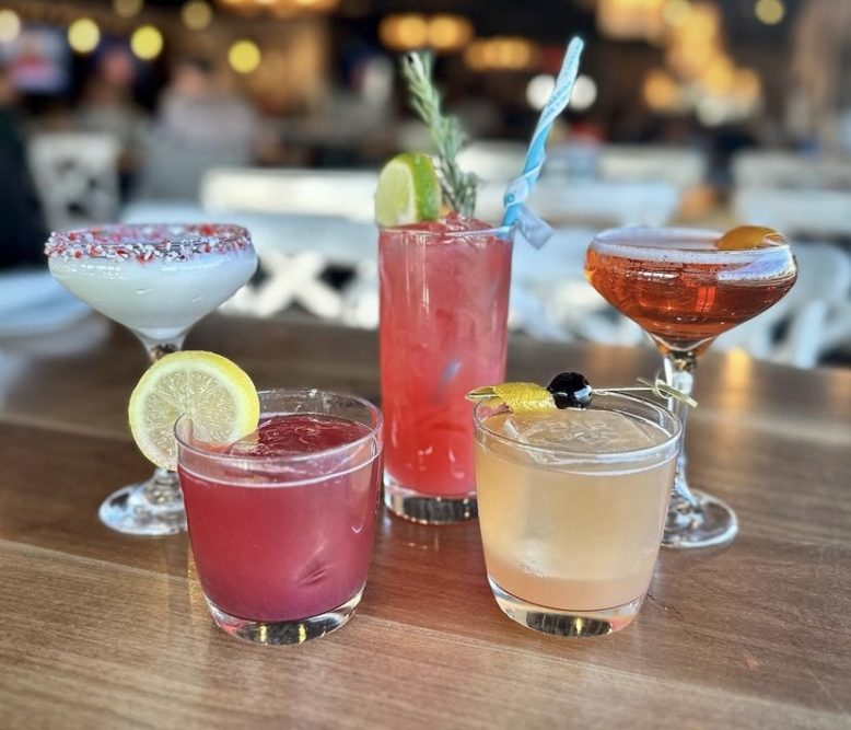 Colorful assorted holiday drinks at Deal Lake Bar + Co.