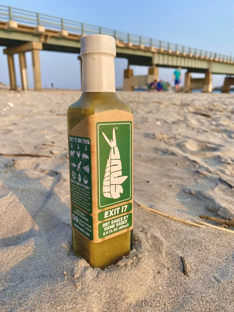 Hank Sauce bottle on the beach 