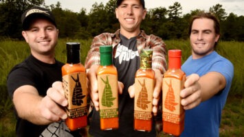 Brian "Hank" Ruxton, Josh Jaspan and Matt Pittaluga show their “Core Four” of sauces: Herb Infused, Cilanktro, Camouflage and Hank’s Heat.