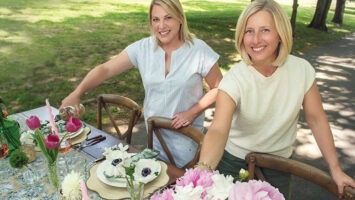 Spoon + Salt founders Courtney Curzi Murray and Amy Tomlinson at an outdoor tablescape
