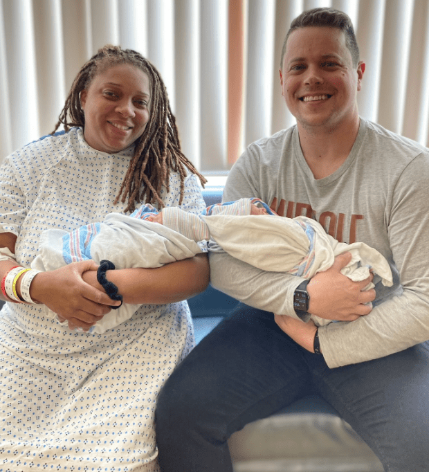 Parents Eve and Billy of Merchantville hold their twin baby boys, Ezra and Ezekiel, born on the last day of 2023 and the first day of 2024, respectively.
