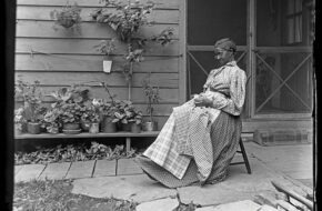 black and white photo of woman sitting on rocking chair on porch