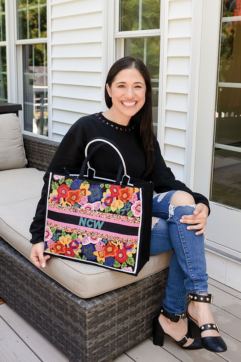 Embroidery Babes founder Michelle Fleischer with one of her custom totes