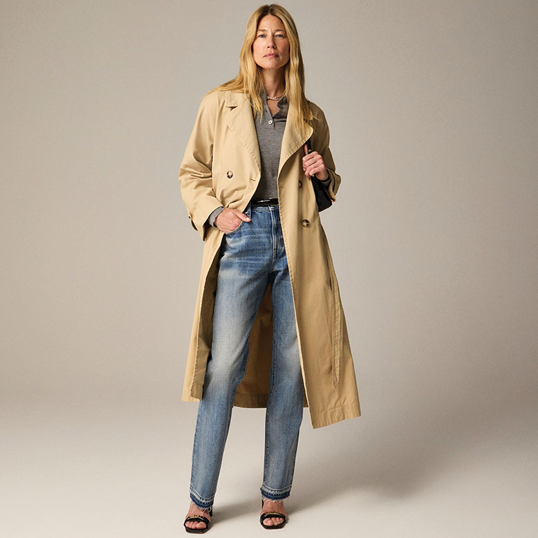 Woman in trench coat and jeans