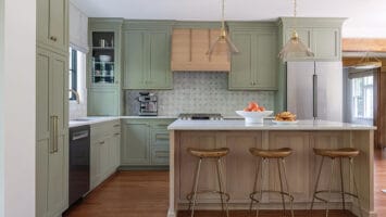 Kitchen with light green cabinets