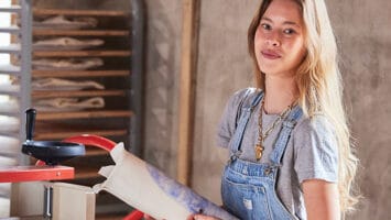 Artist Johanna Younghans sketches on pottery in her Bay Head studio