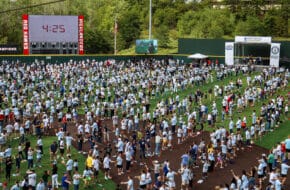 A crowd of participants on the field of Yogi Berra Museum.