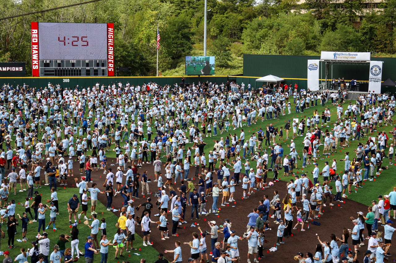A crowd of participants on the field of Yogi Berra Museum.