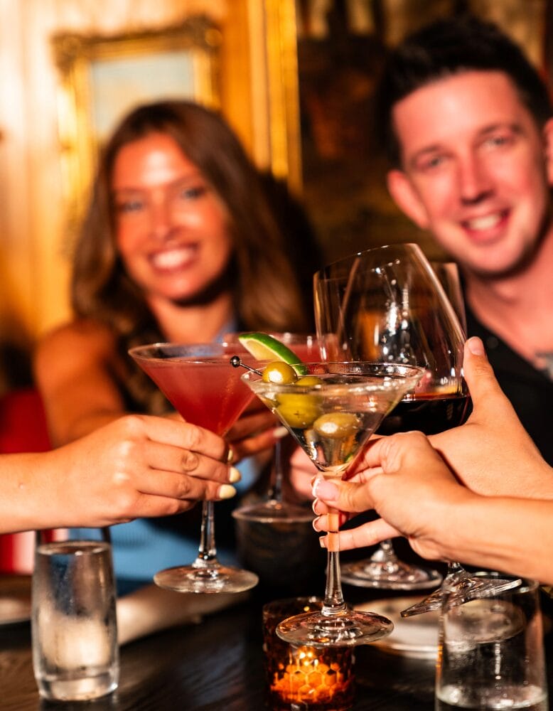 Guests toast cocktails at The 130 Club in Tenafly, New Jersey
