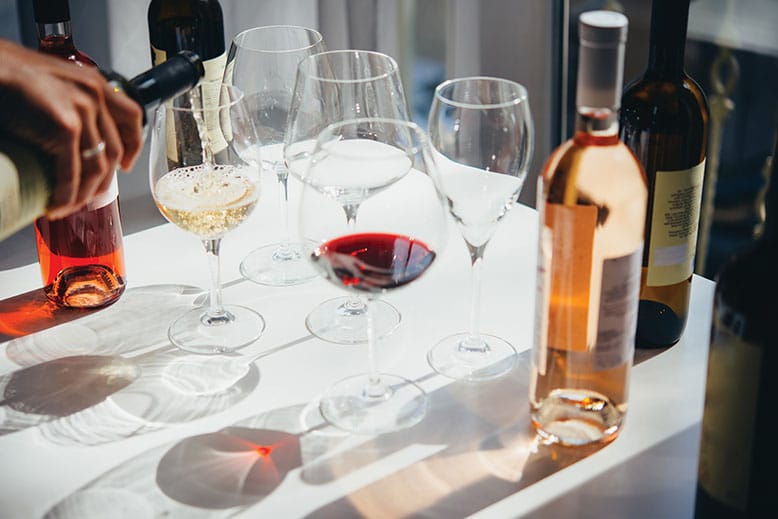 Table set with wine glasses and wine